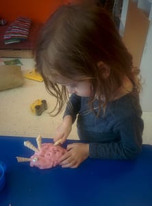 Playing with seashells and home-made play-doh. 
